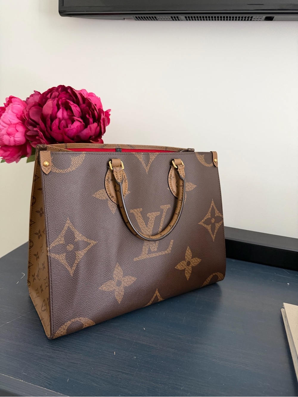 OnTheGo MM Louis Vuitton Brown Monogram Tote with Red Accents